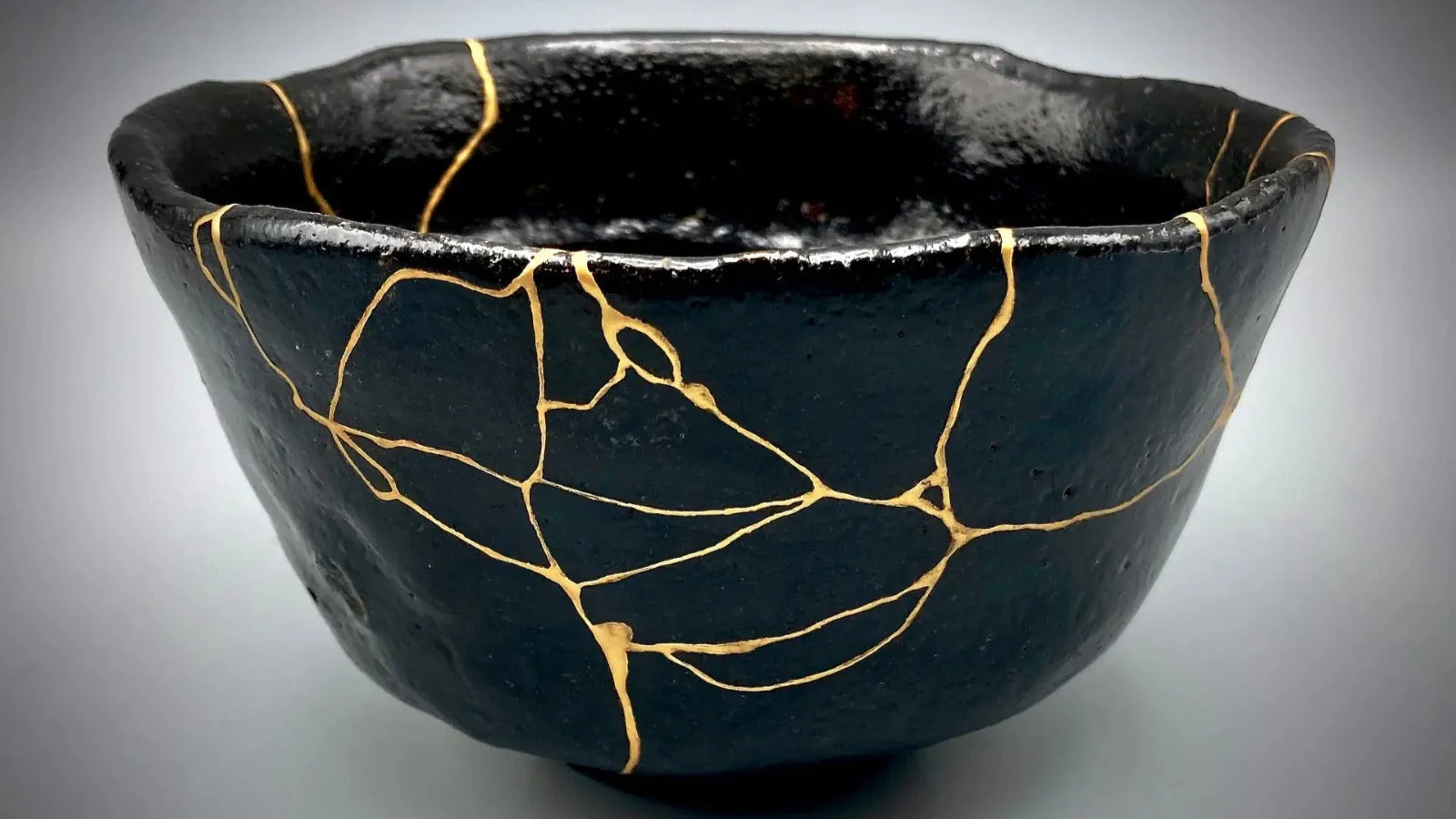 Kintsugi pottery with gold seams